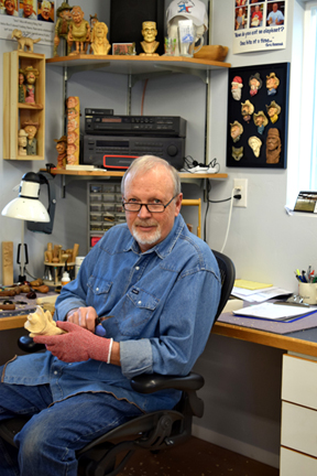 Dale Green carving in his new studio